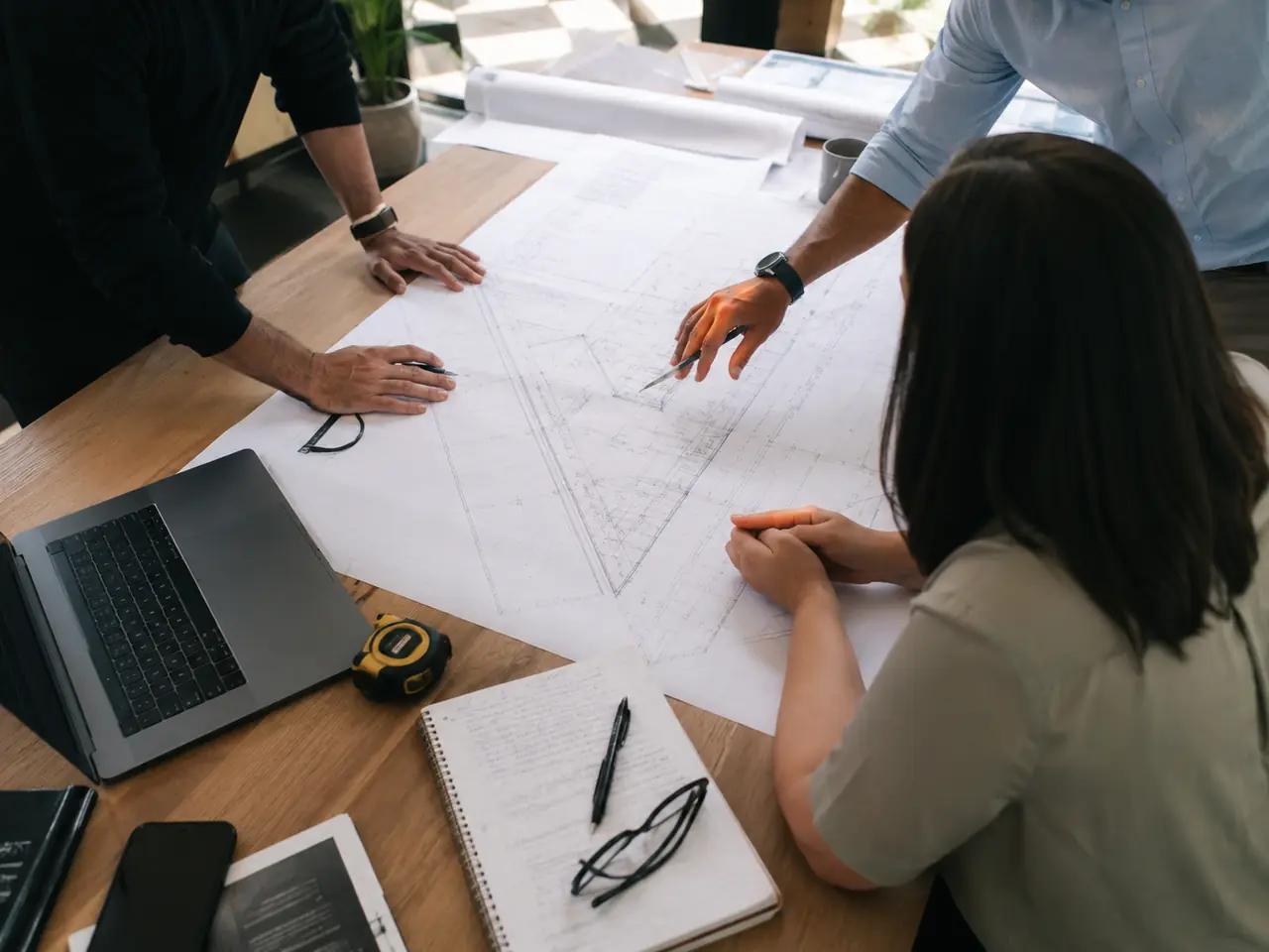 Technical team reviewing an architectural drawing